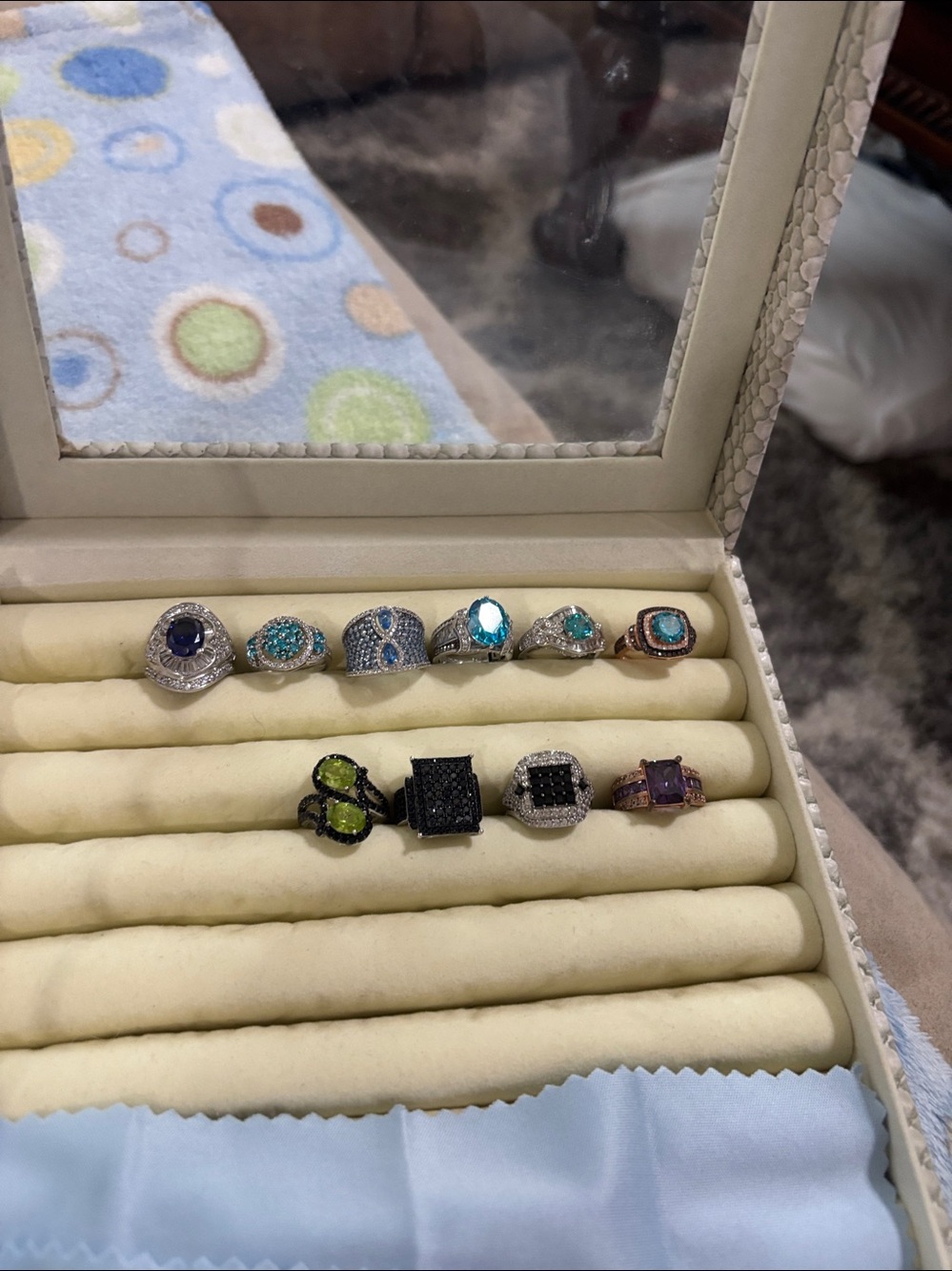 JTV all sz 5 asst of rings  in colored czs  blues, teaks, blue, black,purple,
